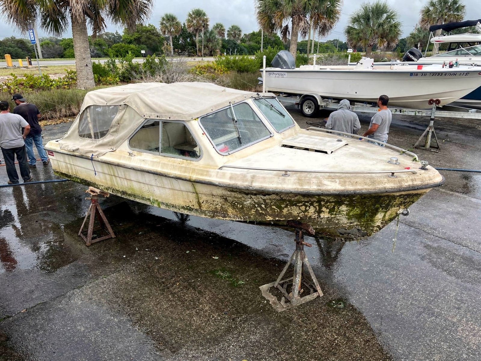 21 ft Thompson 21 from Azalea Park, FL on stands at a repair yard after the recovery