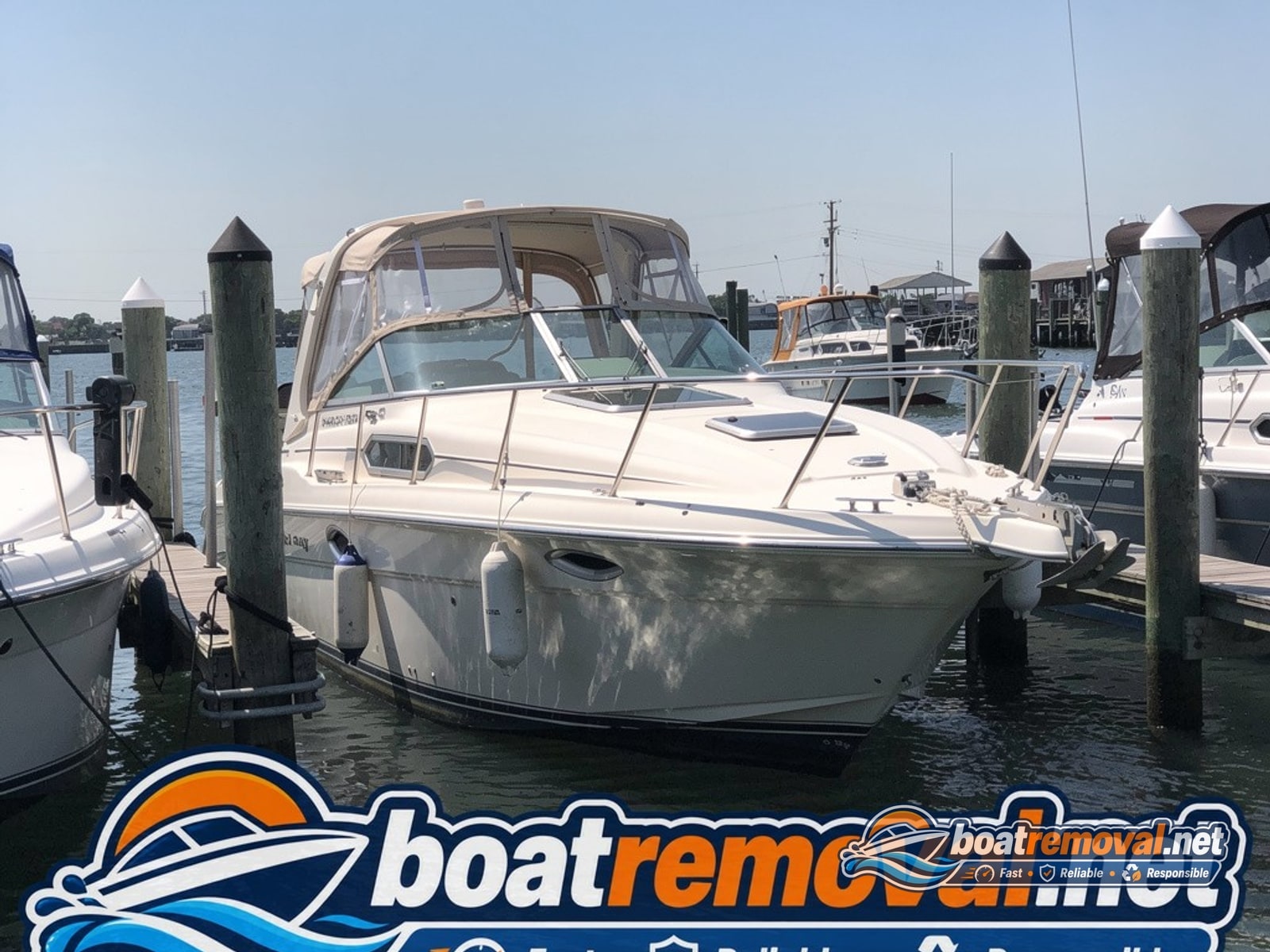 marina boat removal Bay Shore NY, 32 ft Sea Ray cabin cruiser in slip
