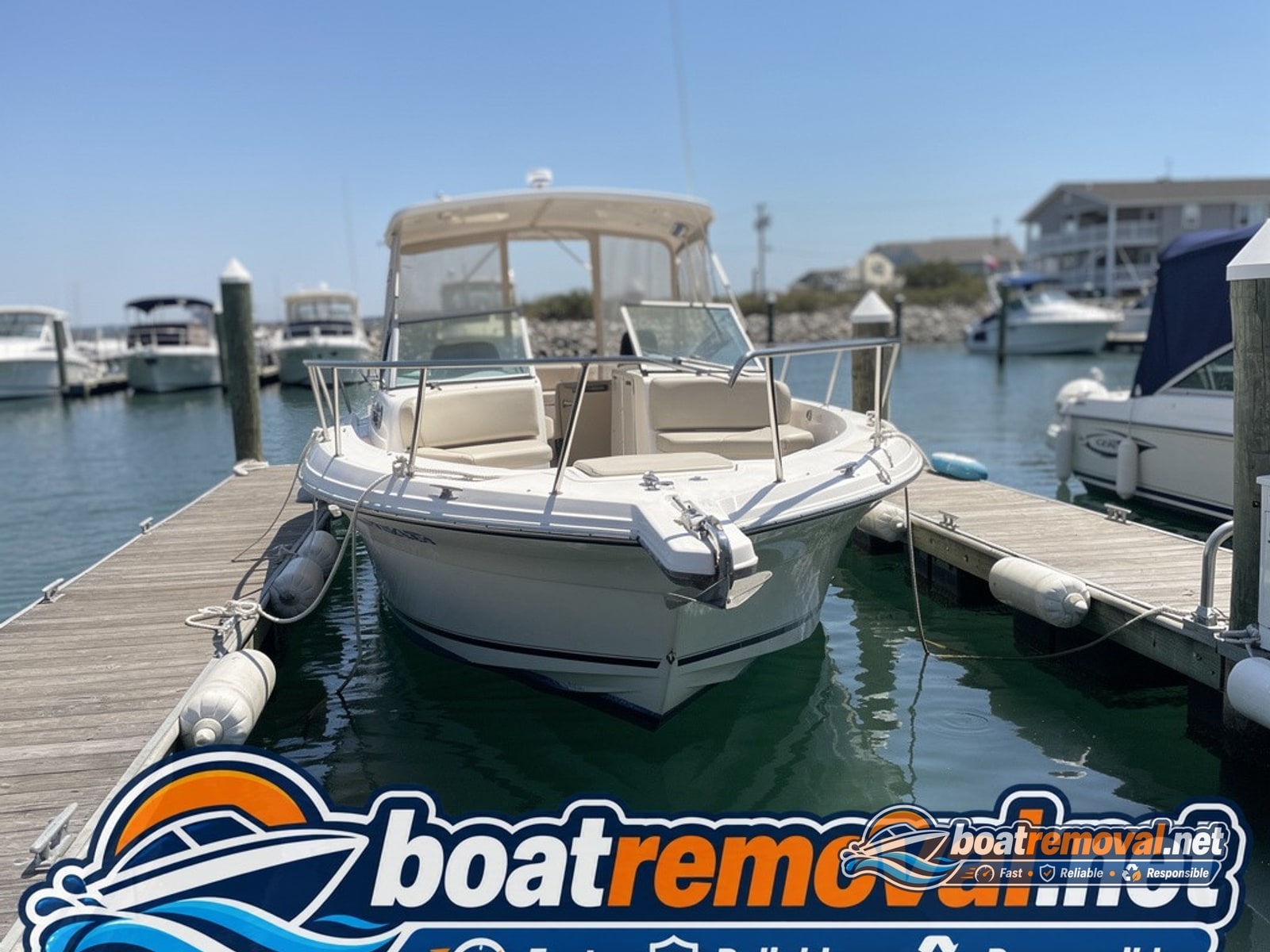 27-foot Regal cuddy cabin tied up in a marina slip in Bethany Beach, Delaware