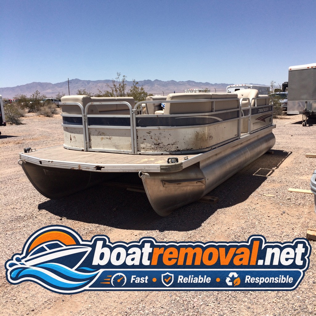 24-foot pontoon boat with a sagging deck sitting in a storage lot near Bullhead City, Arizona
