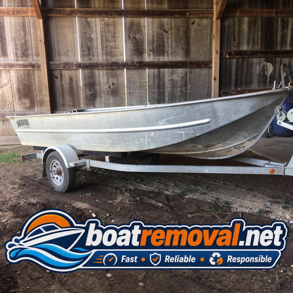 Same jon boat loaded onto a trailer outside a barn on uneven dirt ground