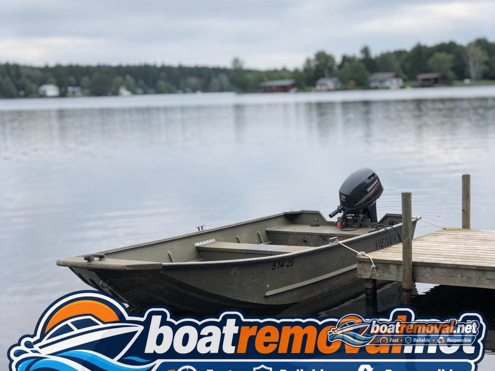 14-foot Lund aluminum fishing boat tied at a dock on Battle Lake, Minnesota before pickup