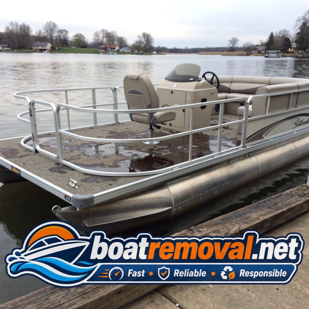 22-foot pontoon boat with a waterlogged deck tied at a ramp near Syracuse, Indiana