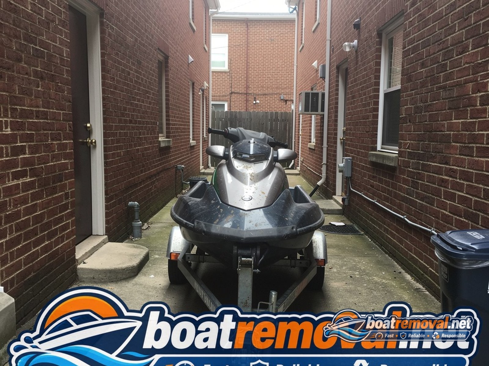 Sea-Doo jet ski on a trailer in a narrow side passage between rowhouses near Washington Navy Yard, DC