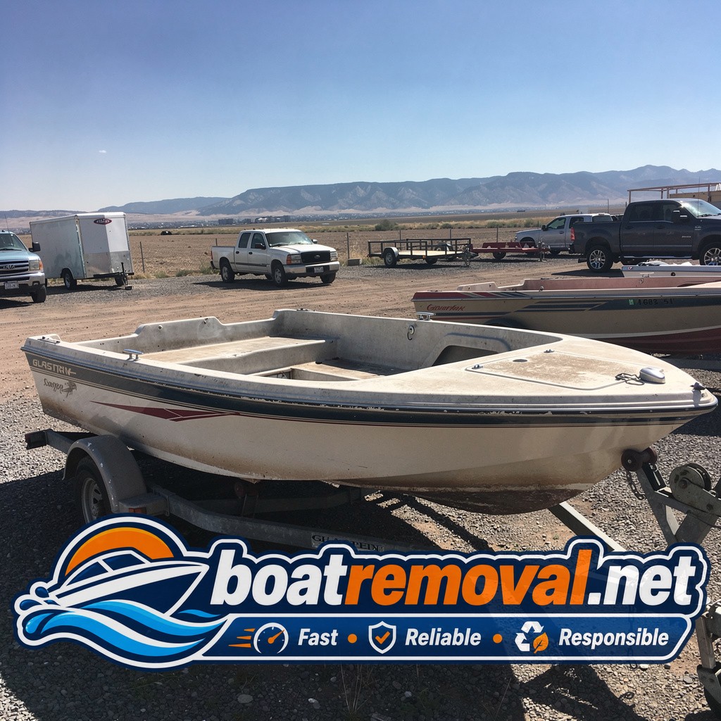 20-foot Glastron with a soft deck sitting in a storage lot near Fort Collins, Colorado