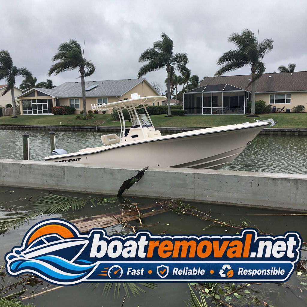 23-foot Grady-White center console driven onto a seawall after a storm in Fort Myers, Florida