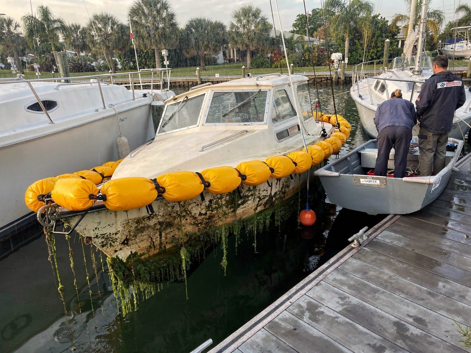 Sunken boat recovery in Boynton Beach, FL: raised with lift bags 22 ft Catalina 22 raised by lift bags in Boynton Beach, FL