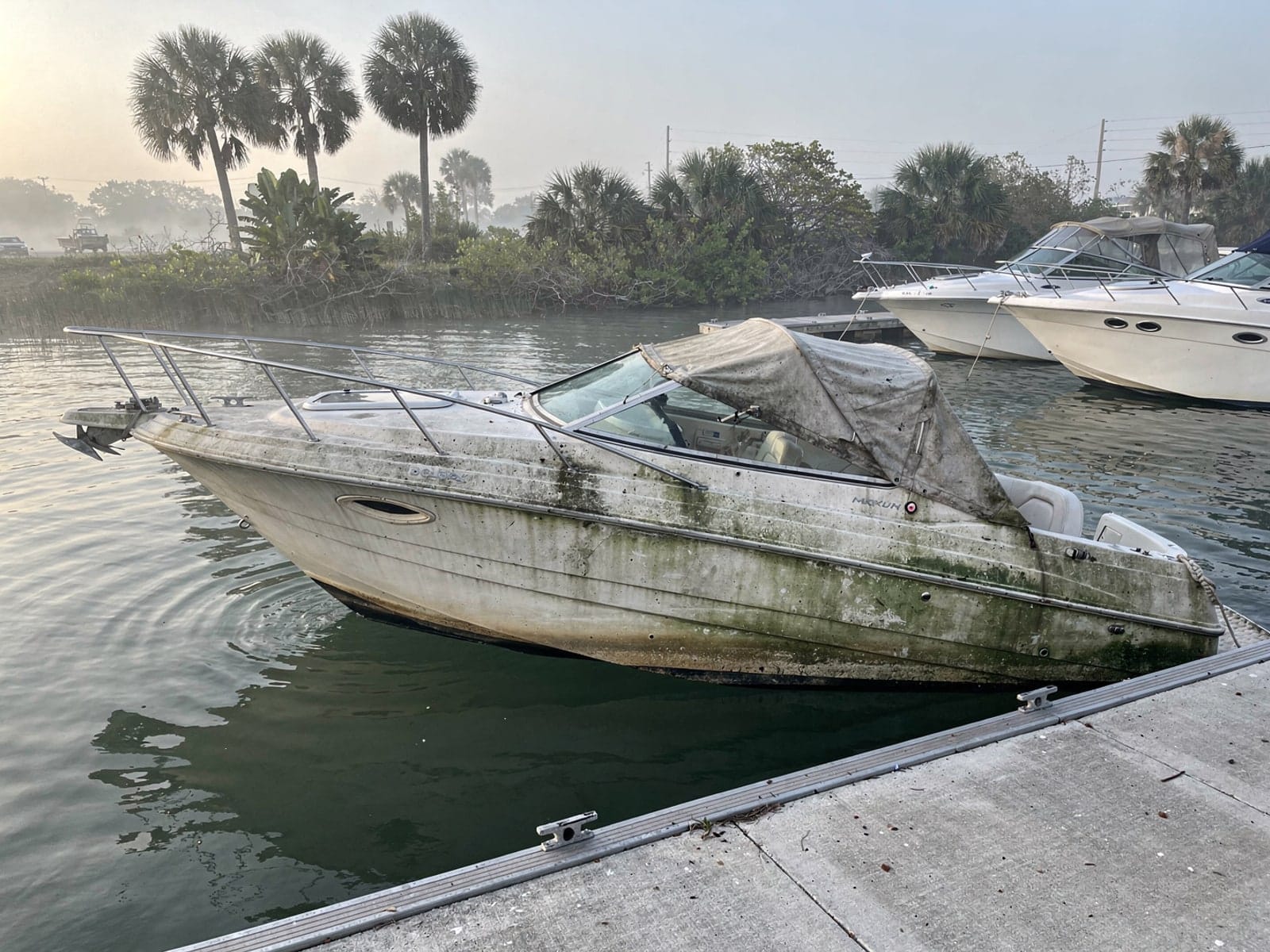 Sunken 24 ft Maxum 2400 SCR by a boat ramp in The Acreage, FL