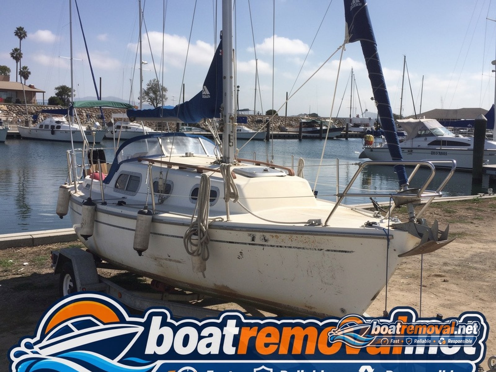 Chula Vista, CA: 34-foot Catalina sailboat loaded for removal Catalina sailboat hull loaded onto a trailer after removal from a marina in Chula Vista, California