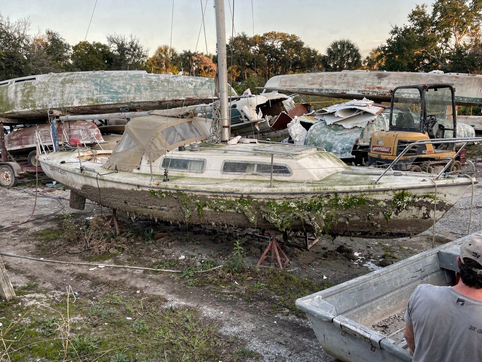 Sunken boat recovery in Citrus Park, FL: at the recycling yard 27 ft Cal 27 from Citrus Park, FL at the recycling yard after the recovery