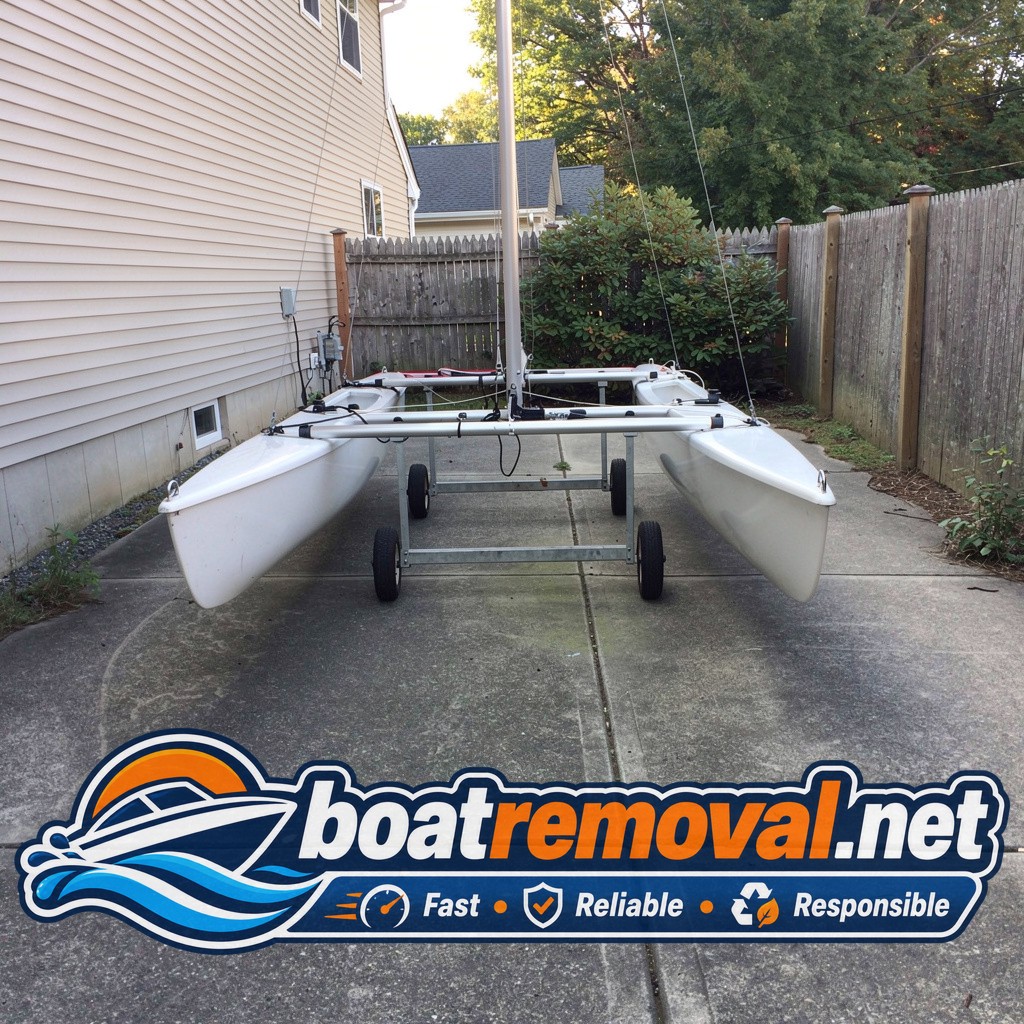 Hobie Cat catamaran hulls loaded onto a trailer after driveway pickup in Danbury, Connecticut