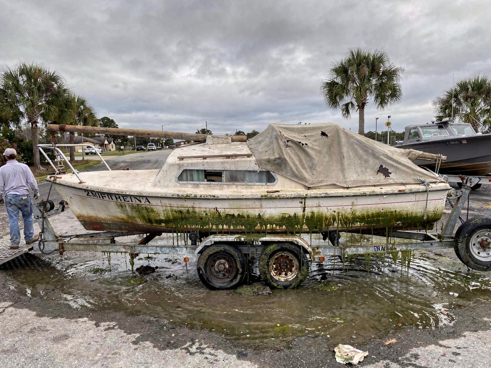 22 ft Catalina 22 pulled out on a trailer at a Daytona Beach, FL boat ramp
