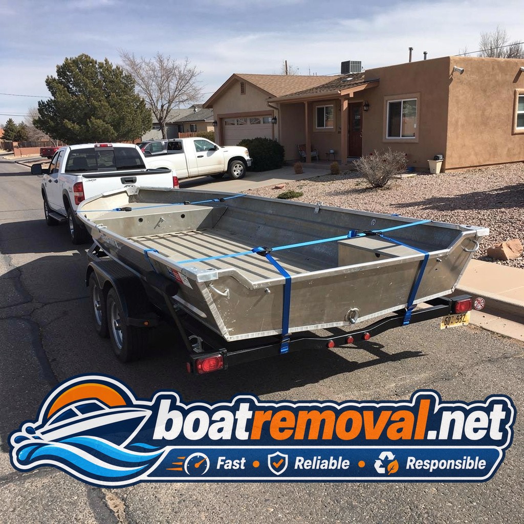 Same aluminum bass boat loaded onto the removal trailer leaving the Espanola property