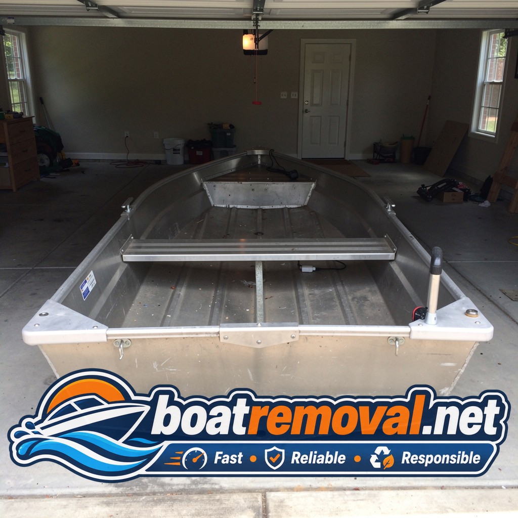 junk boat removal Garner NC, 16 ft aluminum jon boat in garage