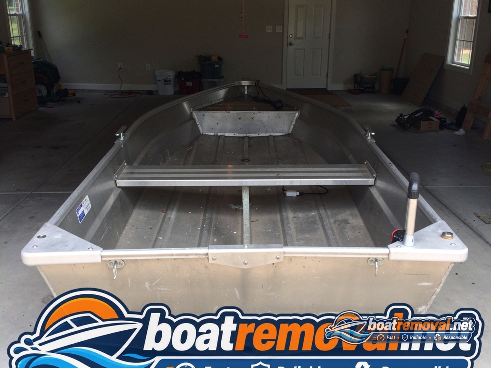 junk boat removal Garner NC, 16 ft aluminum jon boat in garage