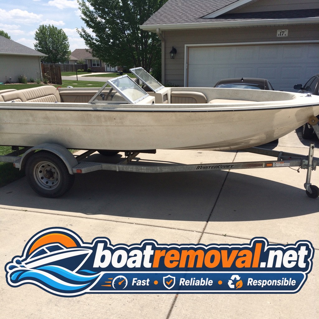 17-foot MasterCraft ski boat on a trailer in a Great Falls, Montana driveway before removal