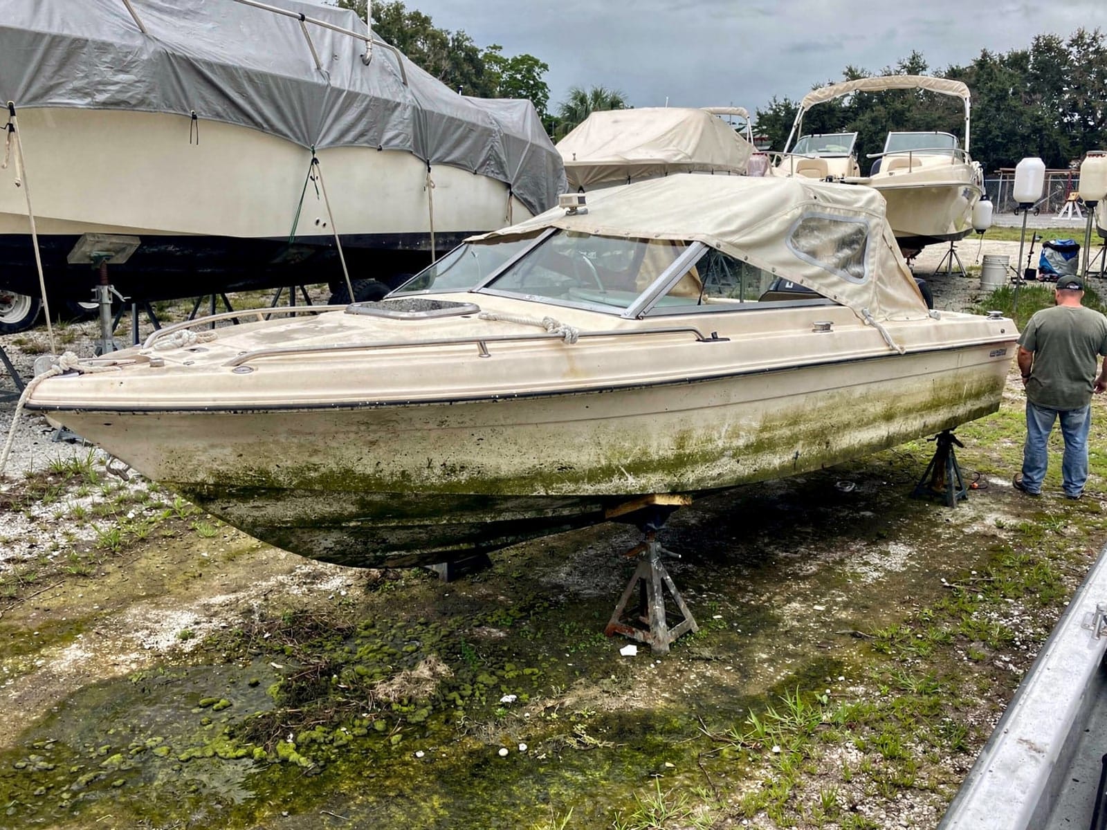 22 ft Larson 220 from Groveland, FL on stands at a repair yard after the recovery