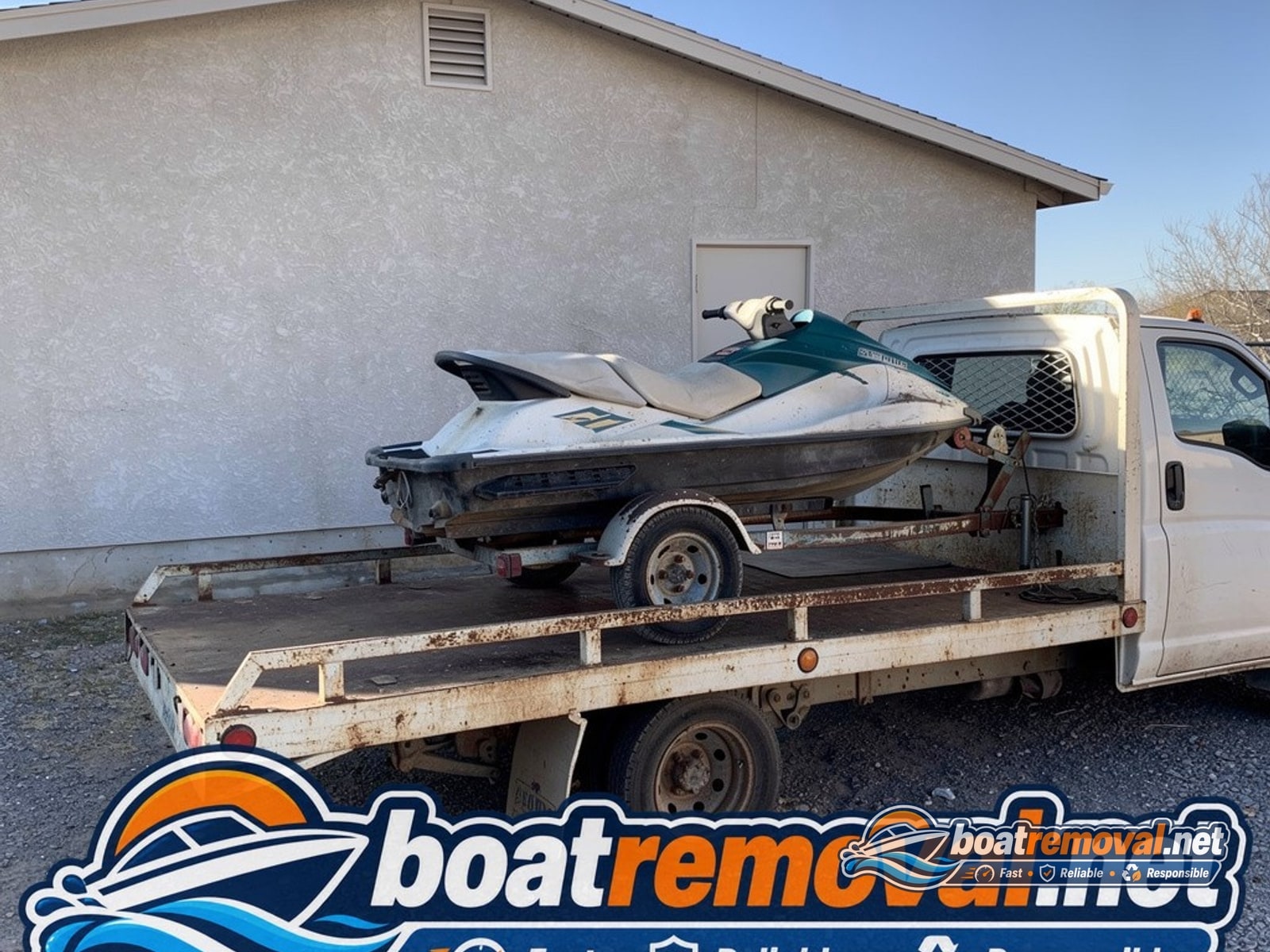 Henderson, NV: two-seat jet ski on trailer loaded for removal Same jet ski loaded onto the removal truck leaving the Henderson property