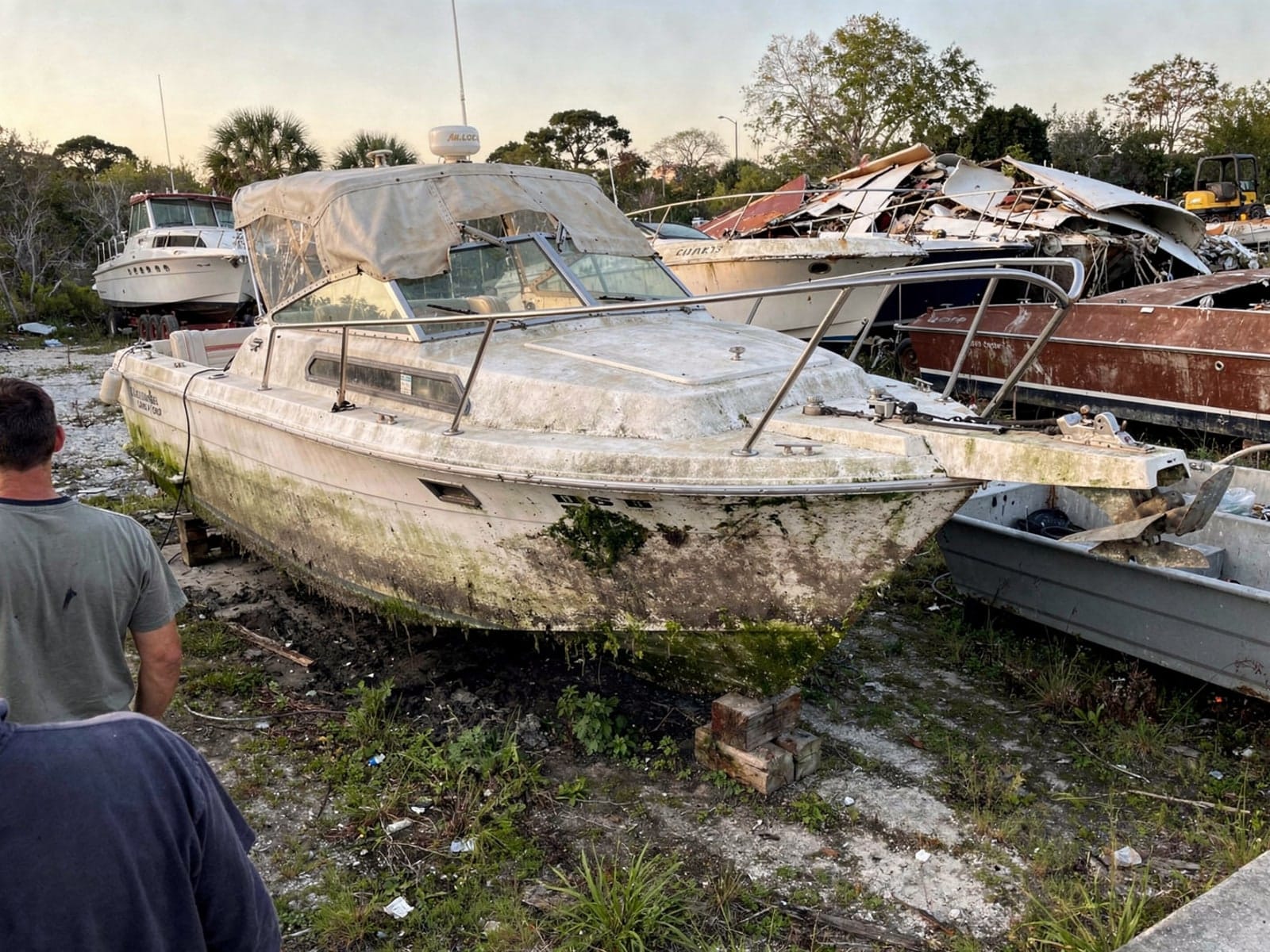 27 ft Chris-Craft Commander 27 from Hialeah Gardens, FL at the recycling yard after the recovery