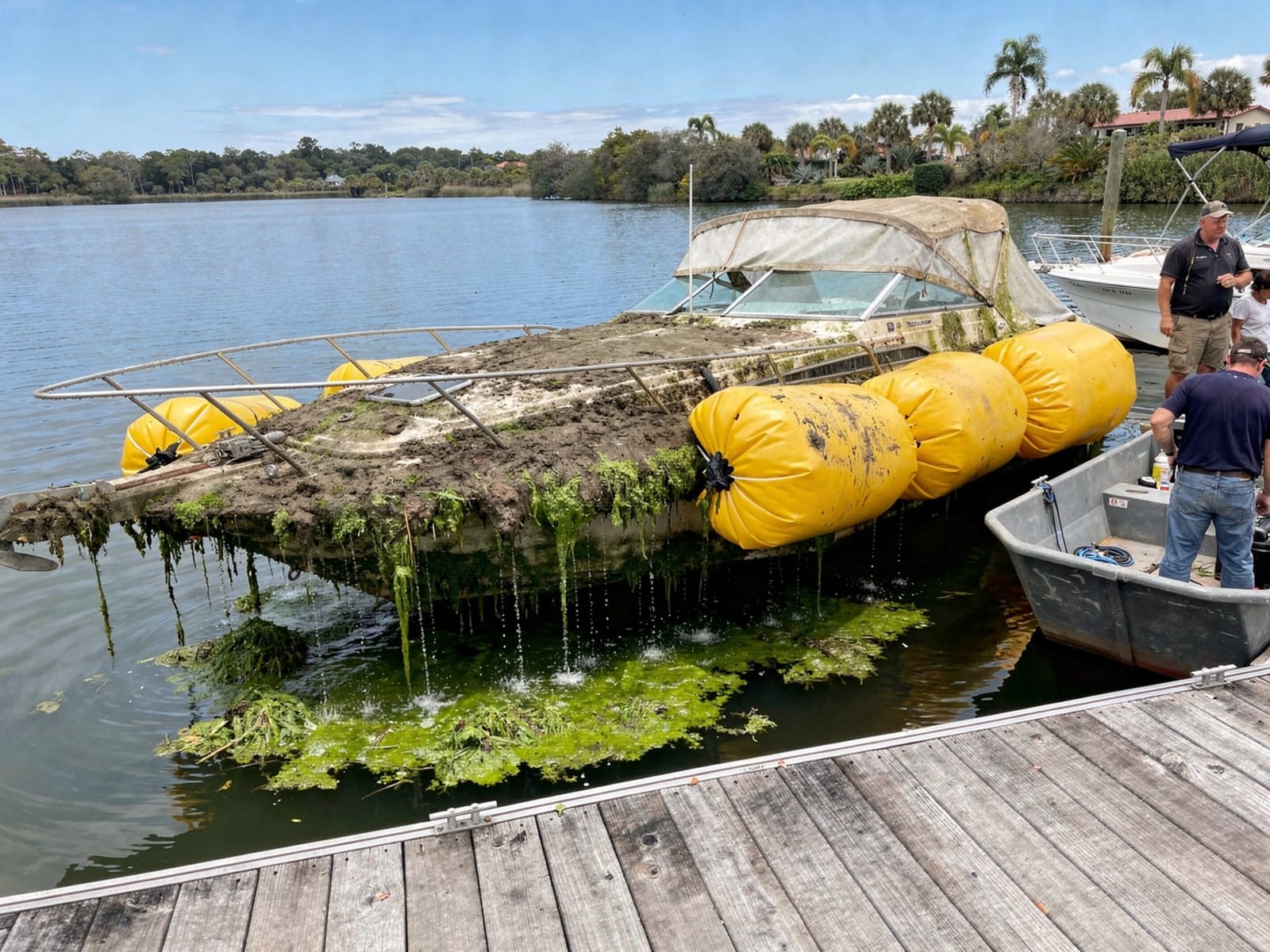 Sunken boat recovery in Lakeland, FL: raised with lift bags 26 ft Sea Ray 268 Sundancer raised by lift bags in Lakeland, FL