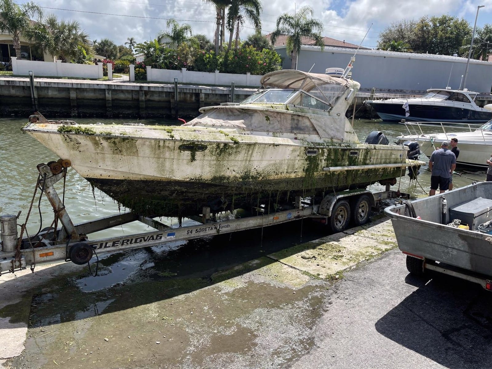 Sunken boat recovery in Land O Lakes, FL: pulled out at the ramp 34 ft Silverton 34 pulled out on a trailer at a Land O Lakes, FL boat ramp