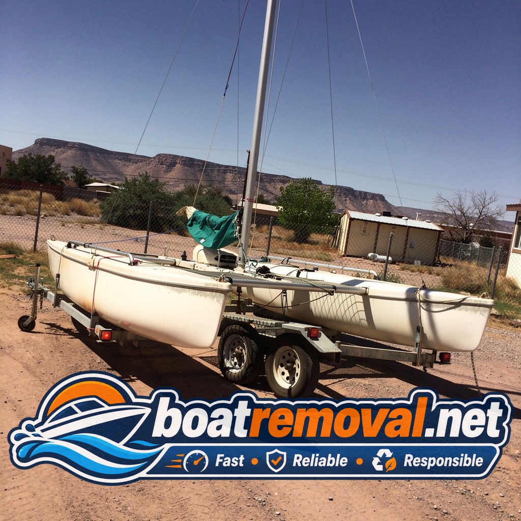 Same Hobie catamaran loaded onto the removal trailer leaving Las Cruces