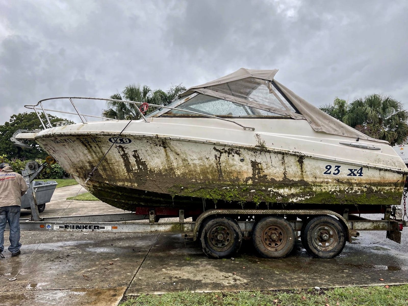Sunken boat recovery in Lehigh Acres, FL: pulled out at the ramp 23 ft Rinker 232 pulled out on a trailer at a Lehigh Acres, FL boat ramp