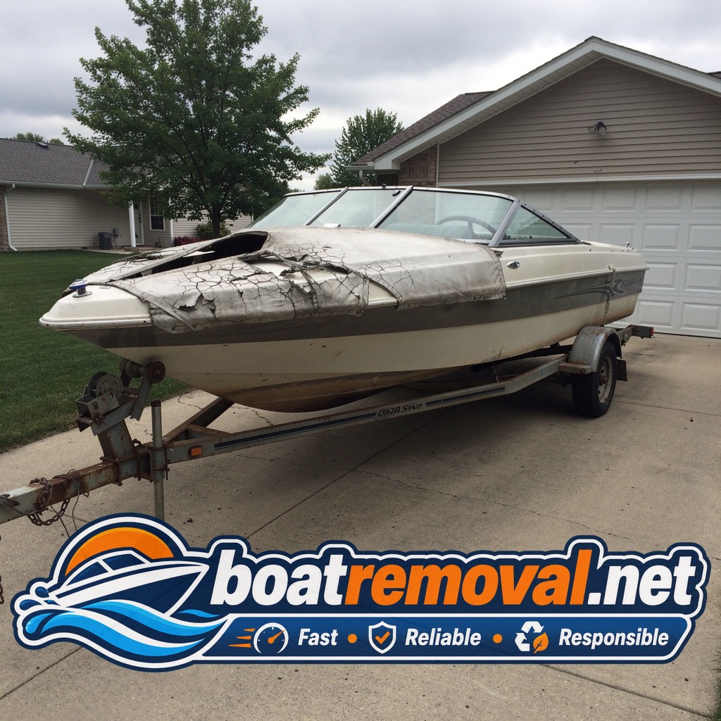 19-foot Chaparral bowrider with a cracked cover sitting on a trailer in a Maple Grove, Minnesota driveway