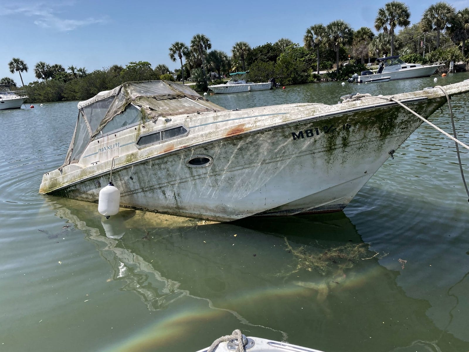 Sunken boat recovery in Fernandina Beach, FL: before Sunken 24 ft Maxum 2400 SCR at its mooring in Fernandina Beach, FL