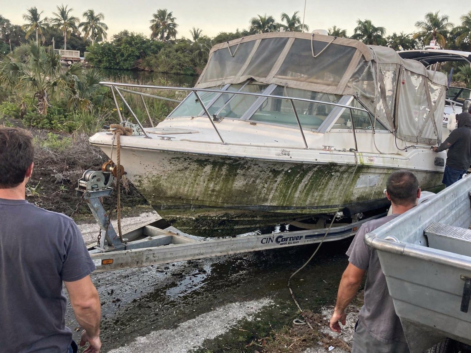 28 ft Carver 28 pulled out on a trailer at a Viera West, FL boat ramp