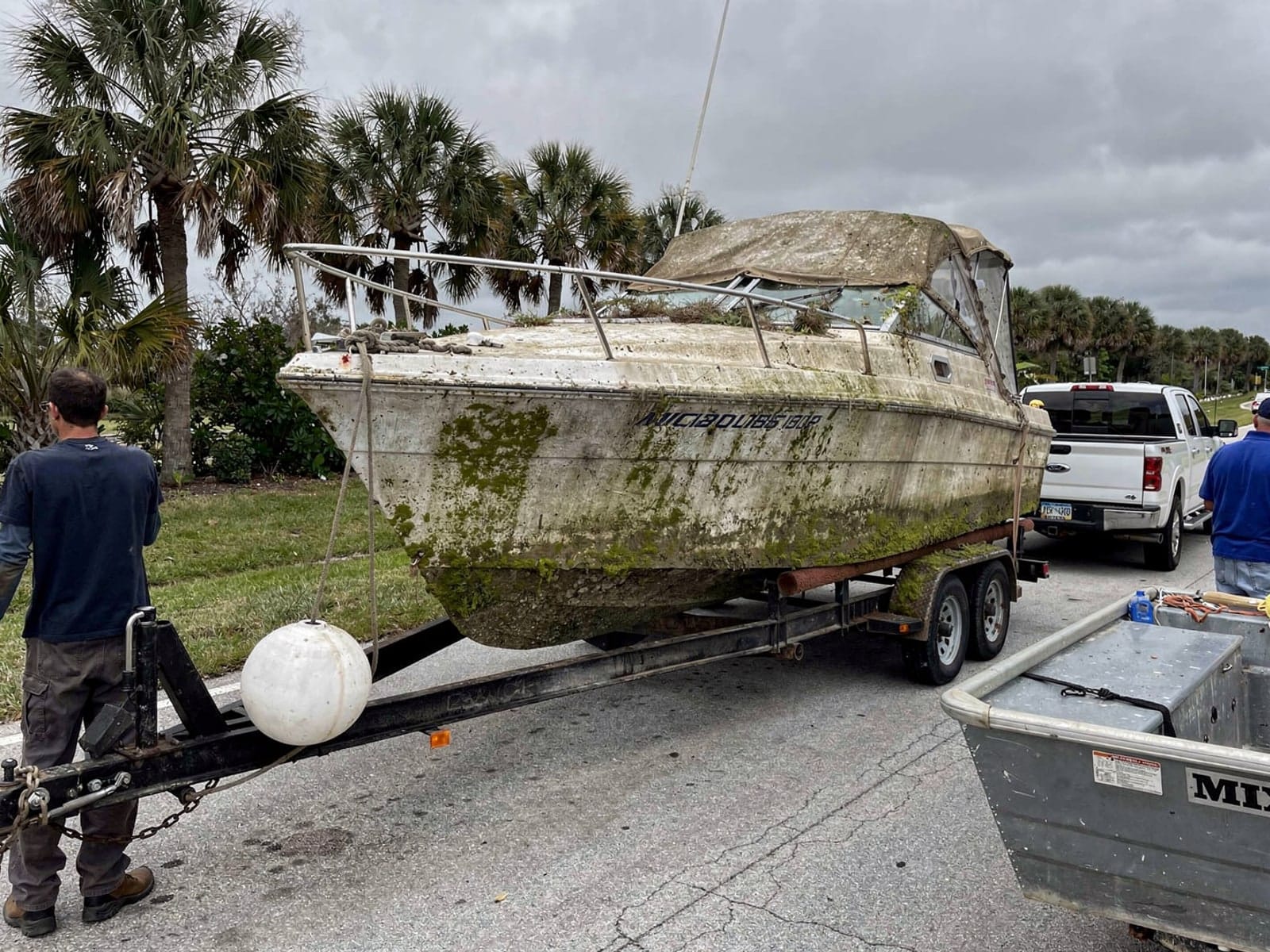 Sunken boat recovery in Westchester, FL: hauled out on a trailer 24 ft Maxum 2400 SCR hauled out of Westchester, FL on a trailer after the recovery
