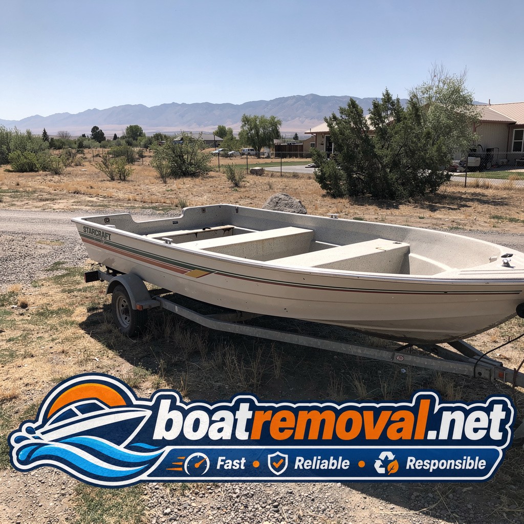 18-foot Starcraft ski boat parked in a yard near Minden, Nevada before removal