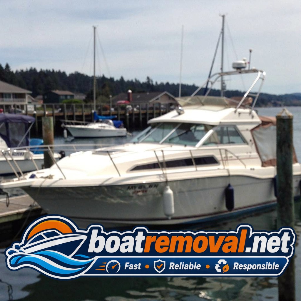marina boat removal Newport OR, 30 ft Bayliner cabin cruiser in slip