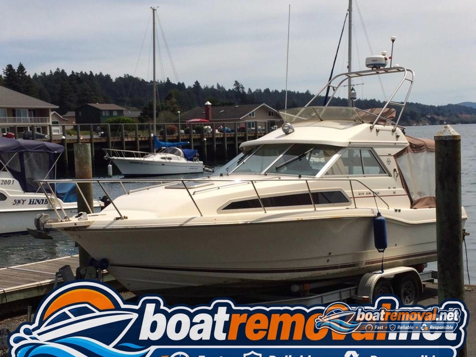 Newport, OR: 30 ft Bayliner cabin cruiser loaded for removal 30 ft Bayliner cabin cruiser loaded for removal, Newport Oregon