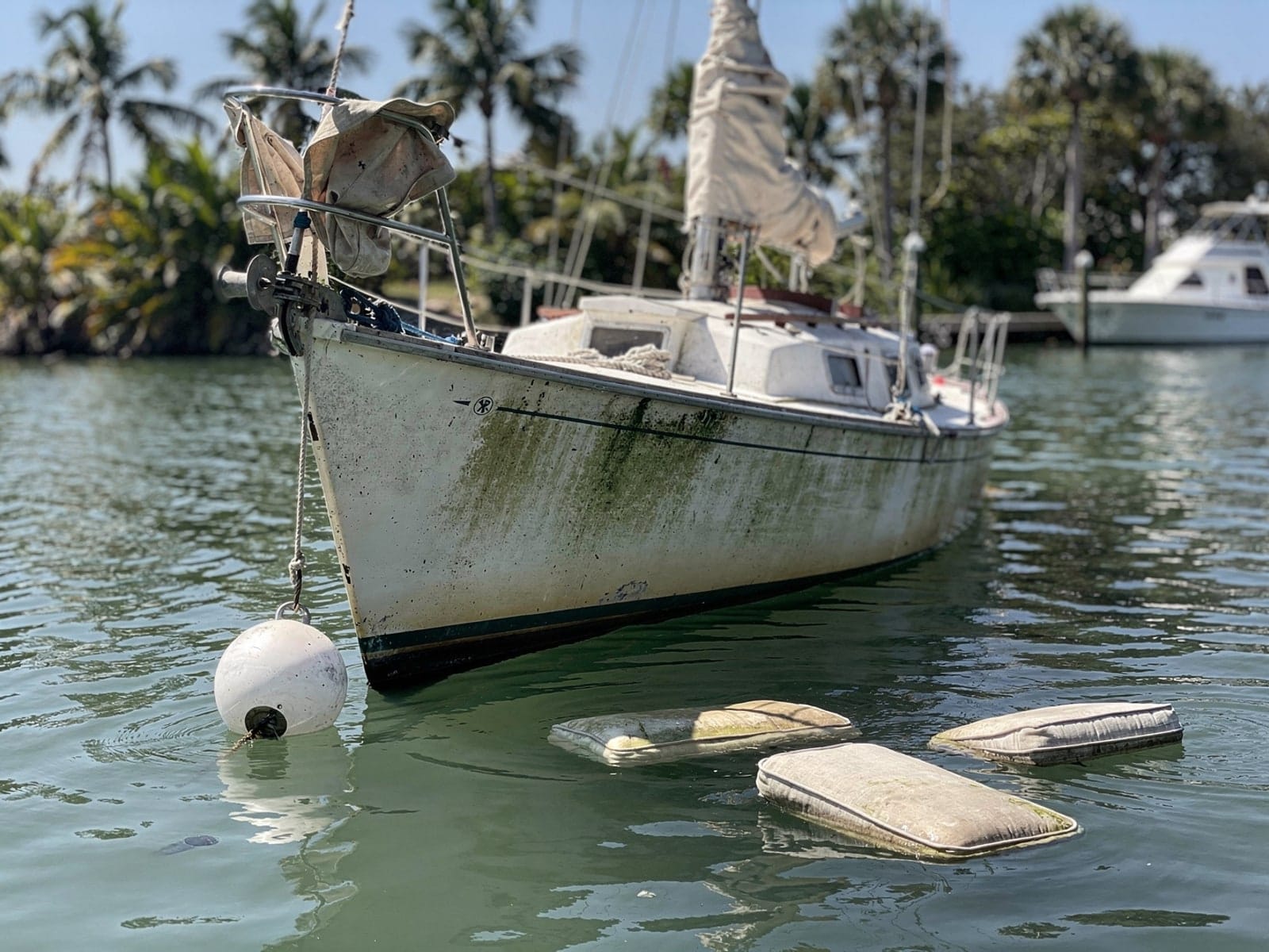 Sunken boat recovery in Nocatee, FL: before Sunken 26 ft Pearson 26 at its mooring in Nocatee, FL