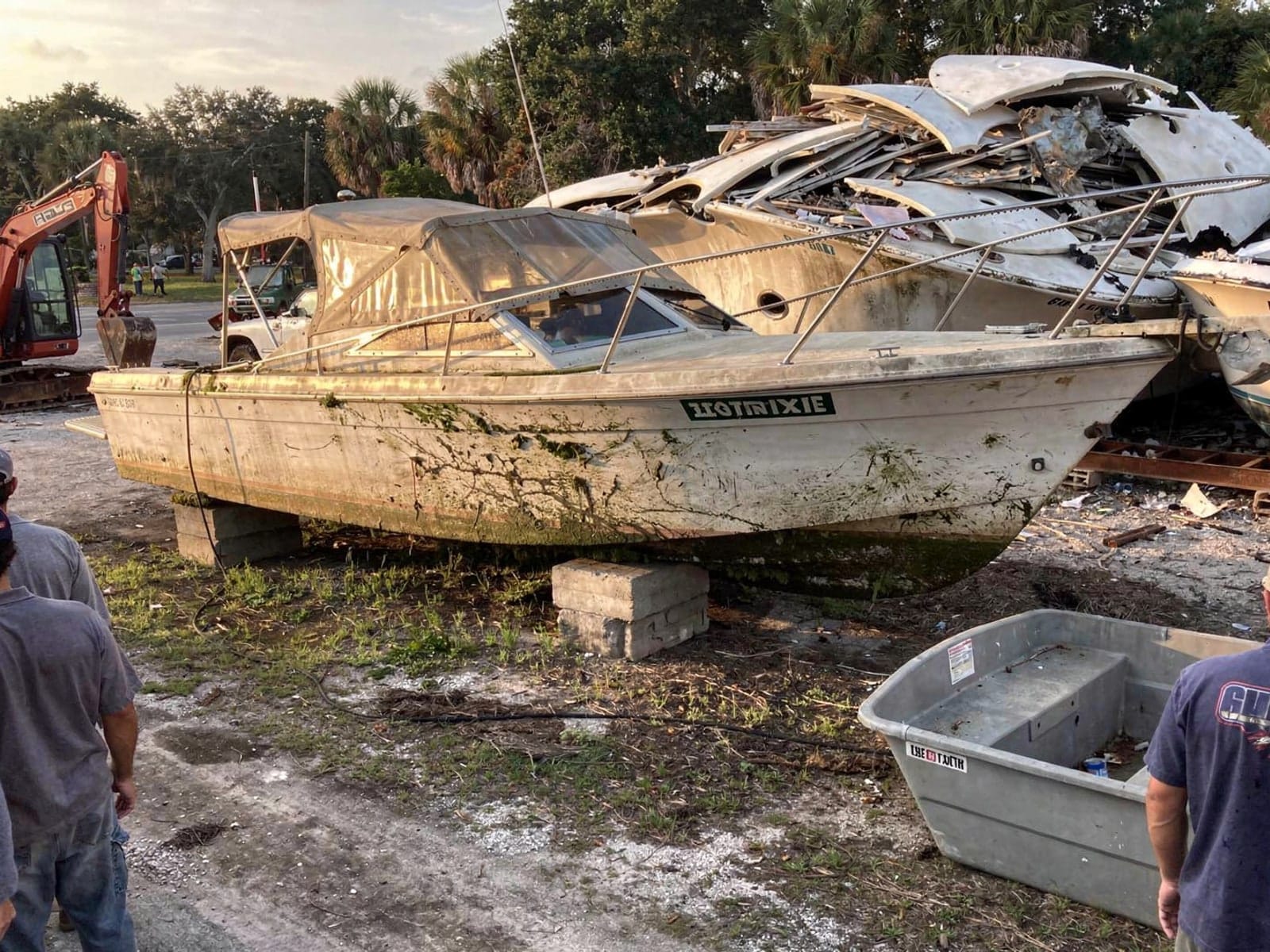 Sunken boat recovery in Oakland Park, FL: at the recycling yard 27 ft Chris-Craft Commander 27 from Oakland Park, FL at the recycling yard after the recovery