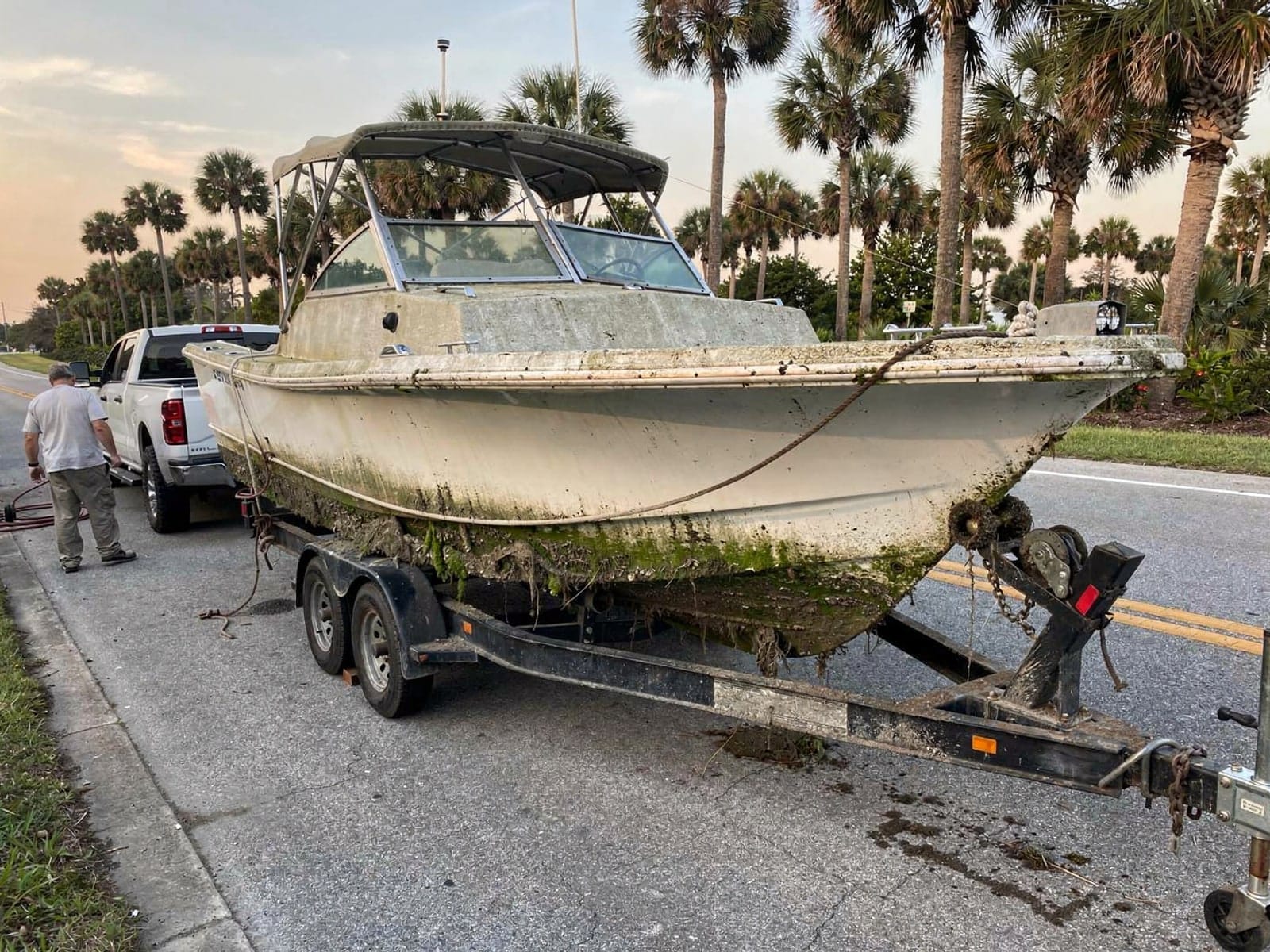 28 ft Bertram 28 hauled out of Oviedo, FL on a trailer after the recovery