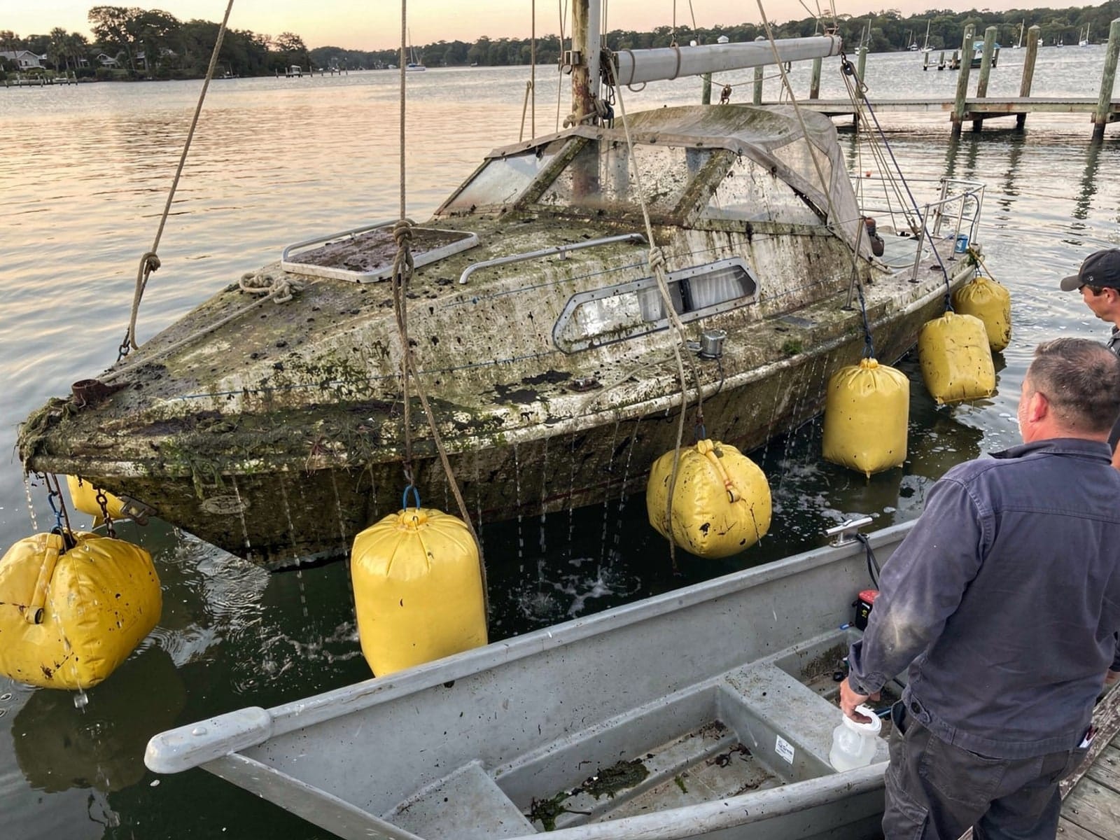Sunken boat recovery in Parkland, FL: raised with lift bags 25 ft O'Day 25 raised by lift bags in Parkland, FL