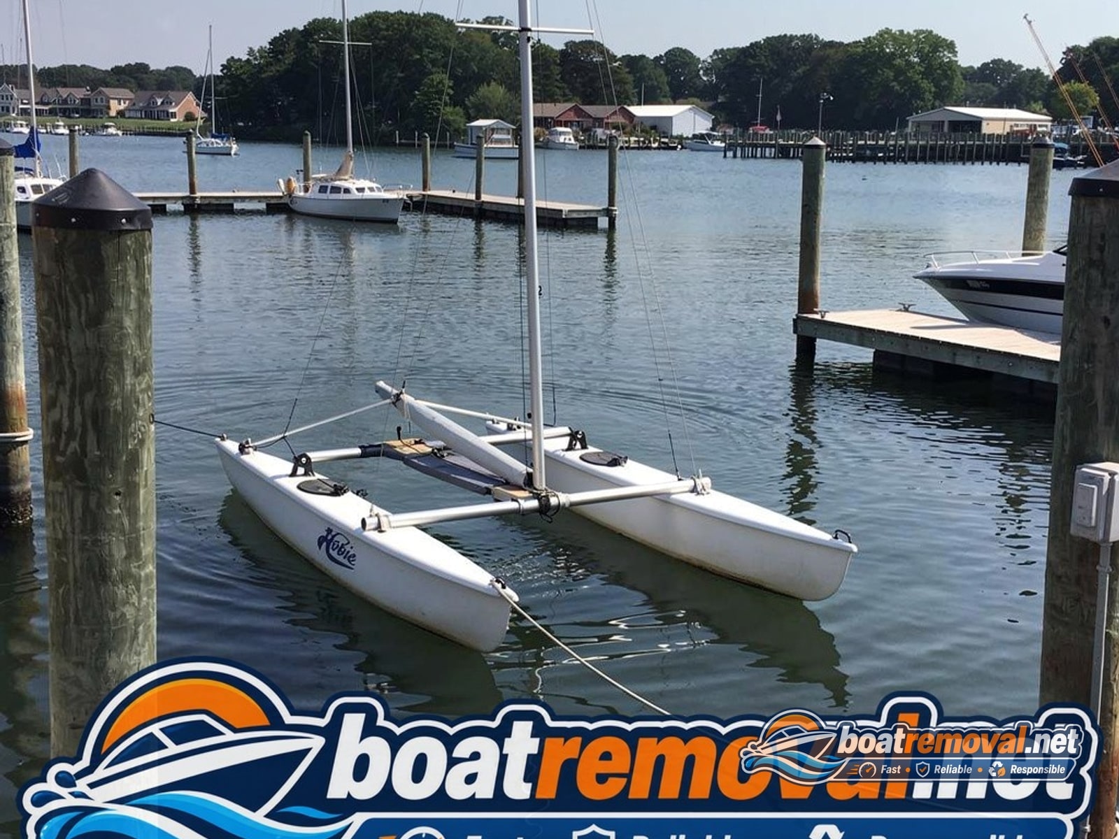16-foot Hobie catamaran resting in a marina slip near Pasadena, Maryland