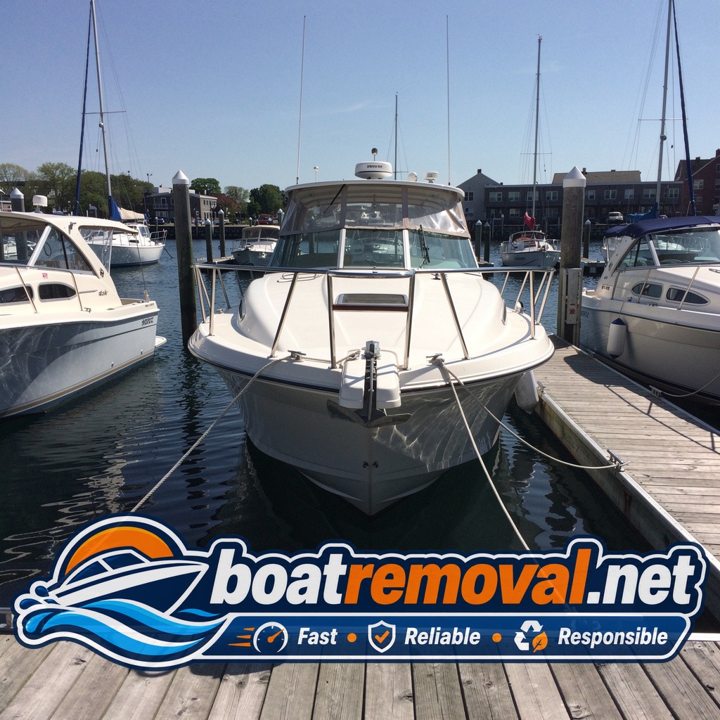 24-foot Formula cruiser tied up in a marina slip in Portland, Maine