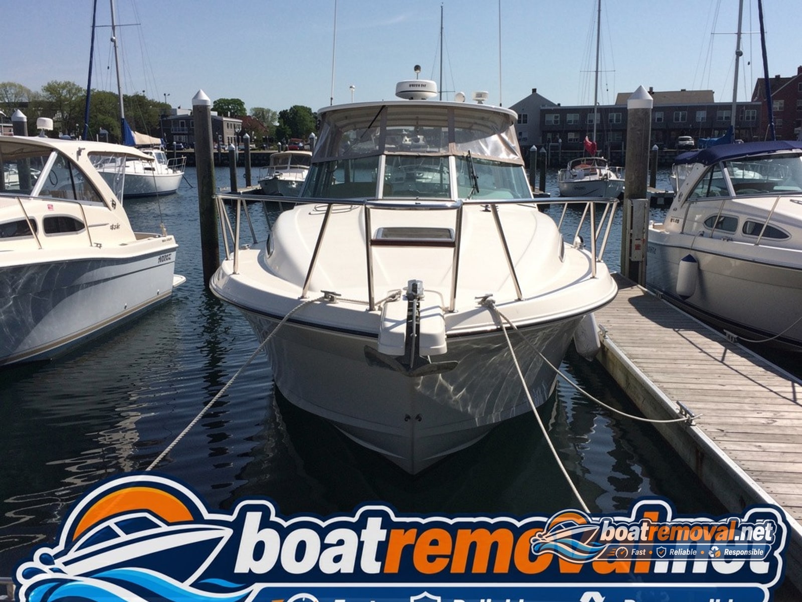 24-foot Formula cruiser tied up in a marina slip in Portland, Maine