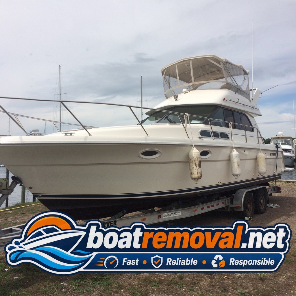 Same Carver motor yacht blocked on a heavy trailer after being pulled from the Portsmouth slip