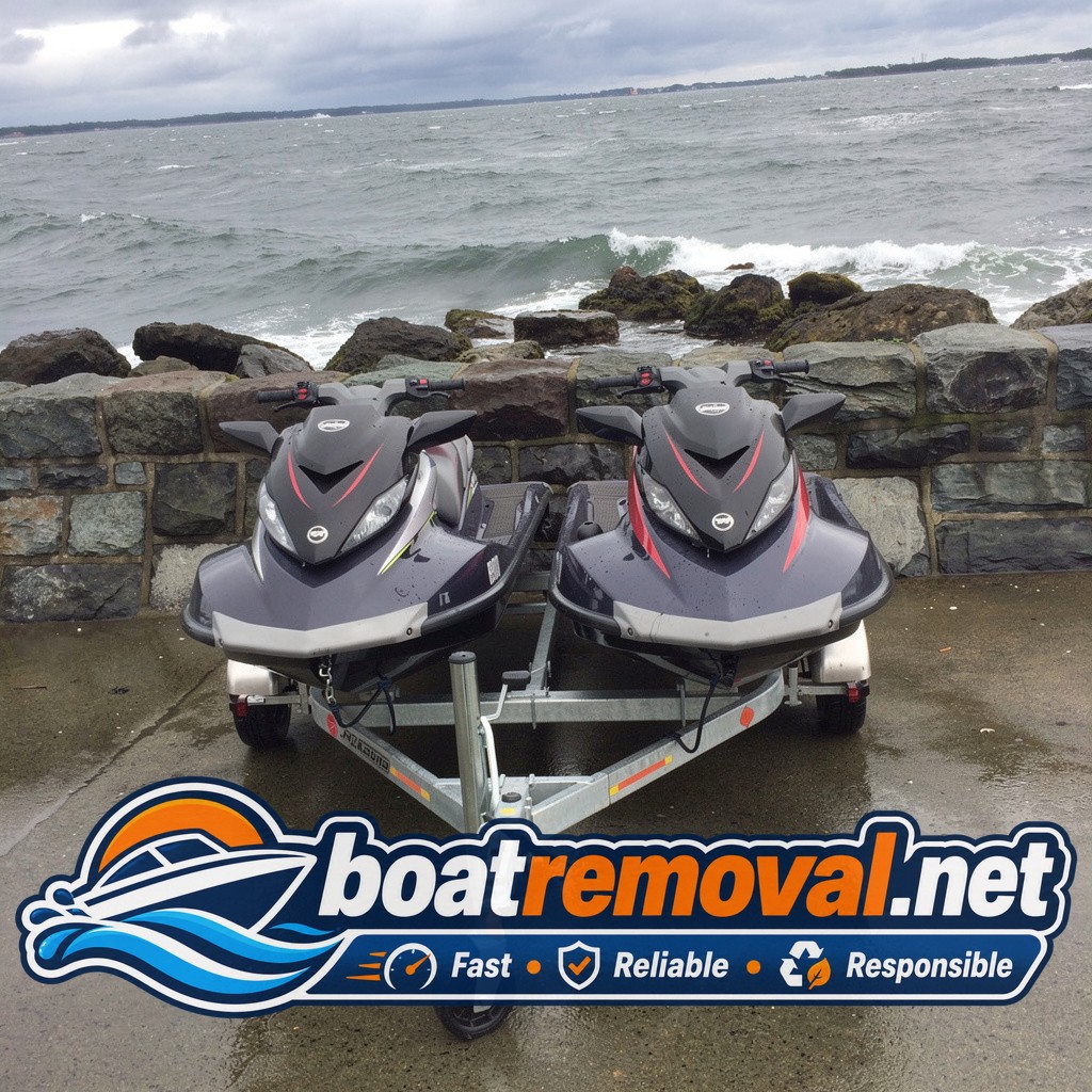 Personal watercraft loaded onto a trailer after being pulled from rocks near Wareham, Massachusetts