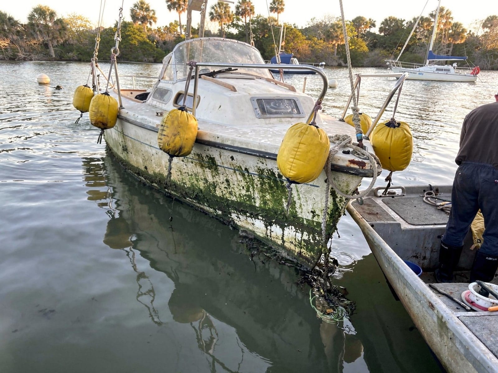 22 ft Catalina 22 raised by lift bags in Riviera Beach, FL