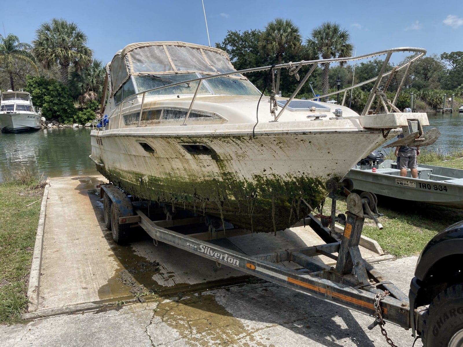 Sunken boat recovery in North Fort Myers, FL: pulled out at the ramp 34 ft Silverton 34 pulled out on a trailer at a North Fort Myers, FL boat ramp