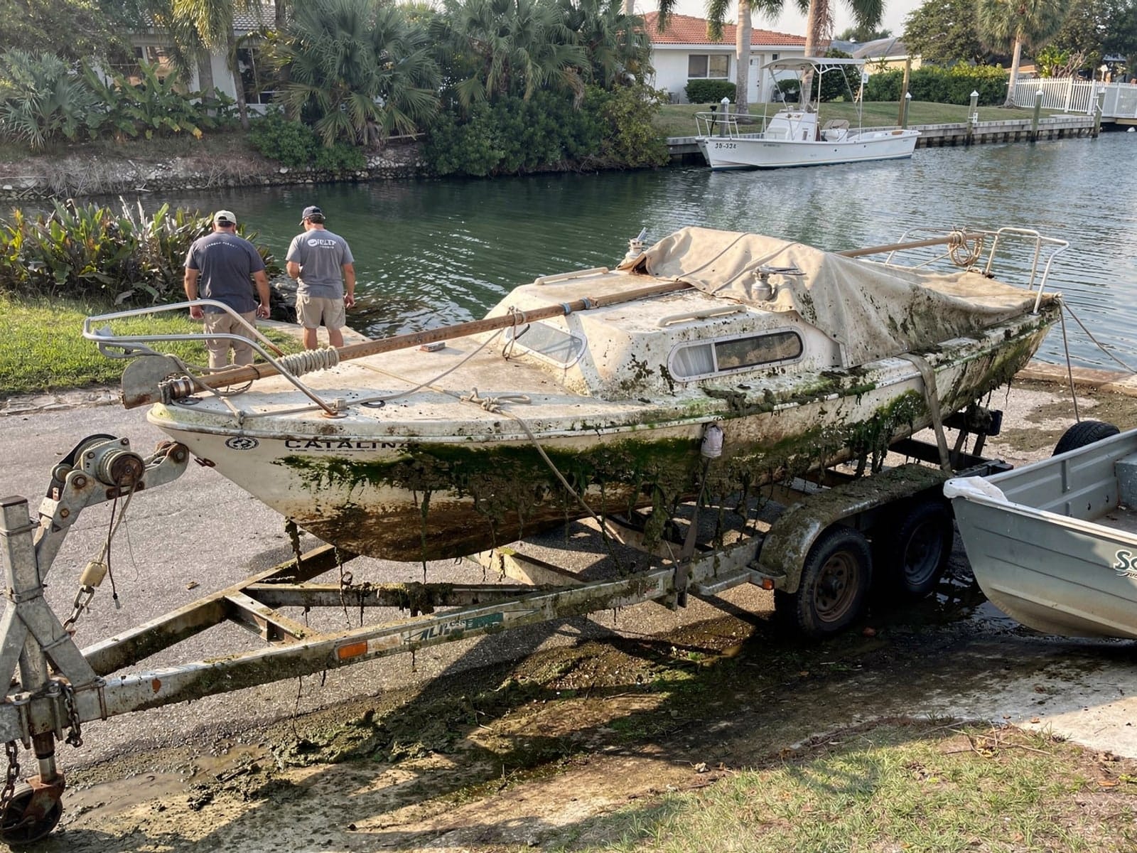 22 ft Catalina 22 pulled out on a trailer at a South Bradenton, FL boat ramp