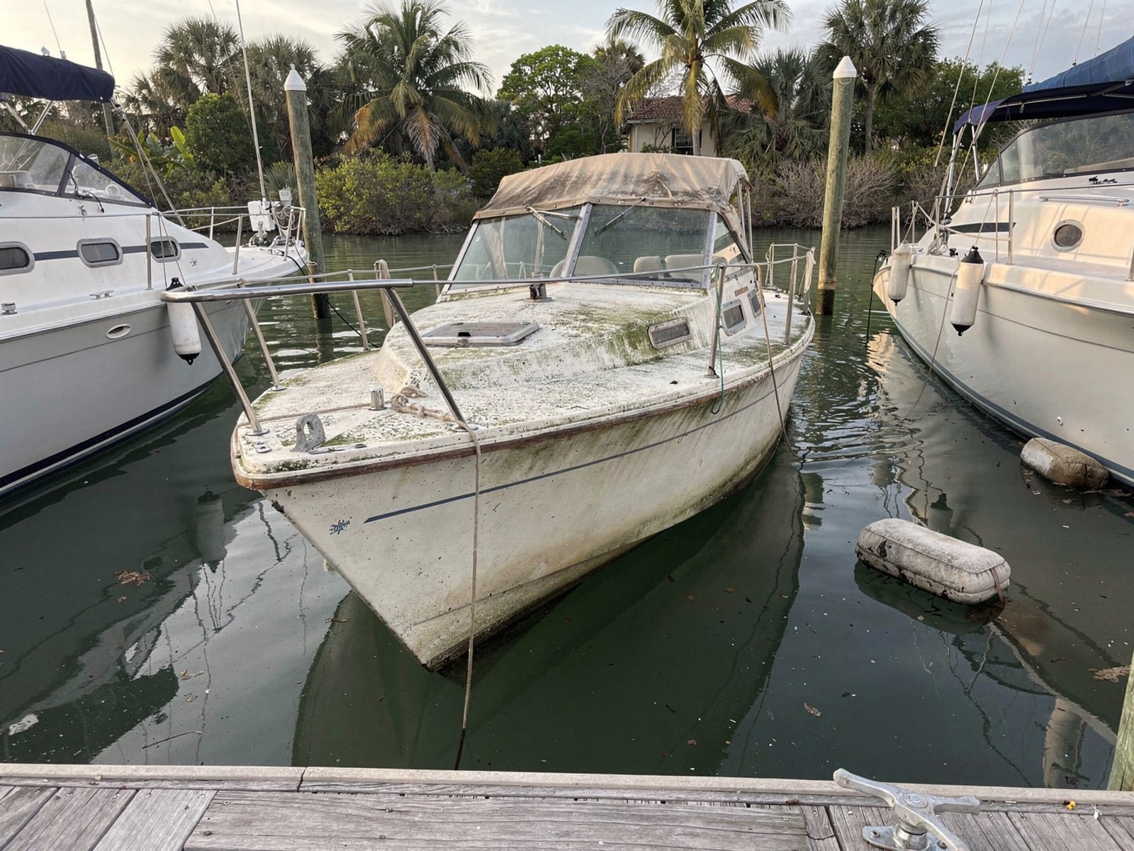 Sunken boat recovery in St Augustine, FL: before Sunken 26 ft Pearson 26 in a marina slip in St Augustine, FL