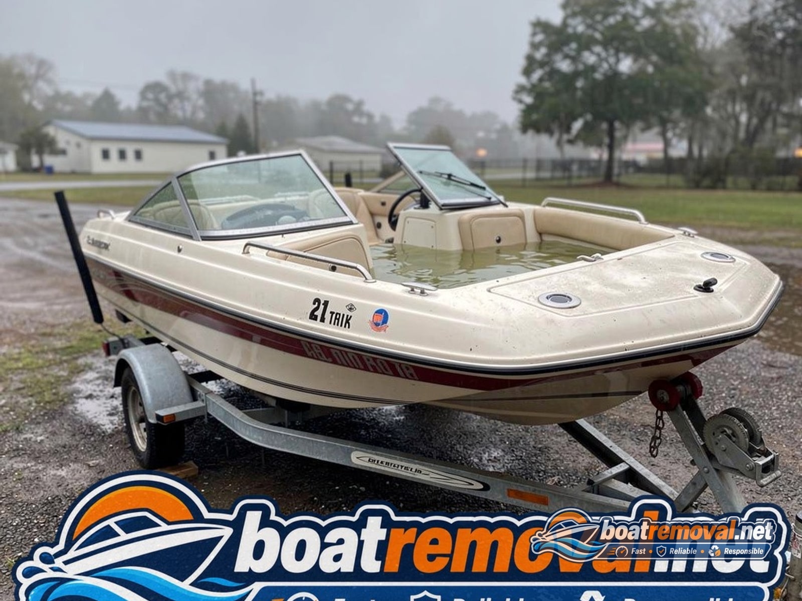 storm damaged boat removal Conway SC, 21 ft Glastron bowrider half swamped on trailer