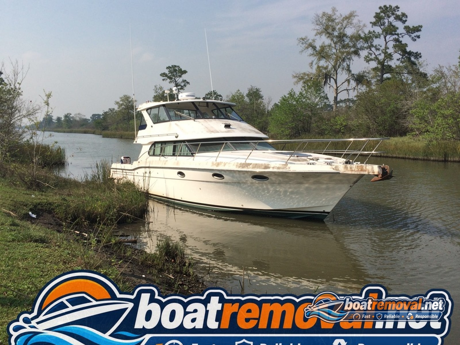 34-foot Carver motoryacht run aground against a canal bank near Houma, Louisiana