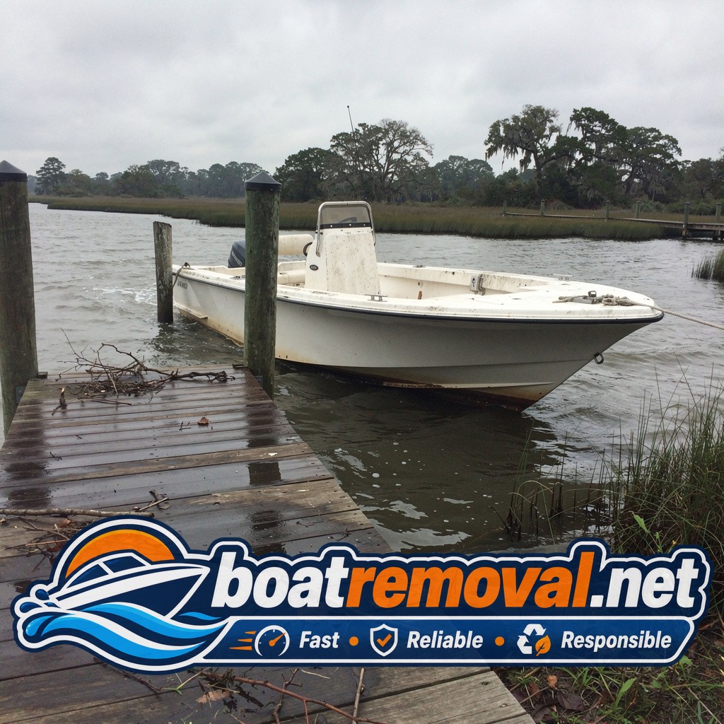 20-foot Mako center console listing at a private dock after a storm near Midway, Georgia